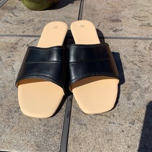 Black low wedge mules